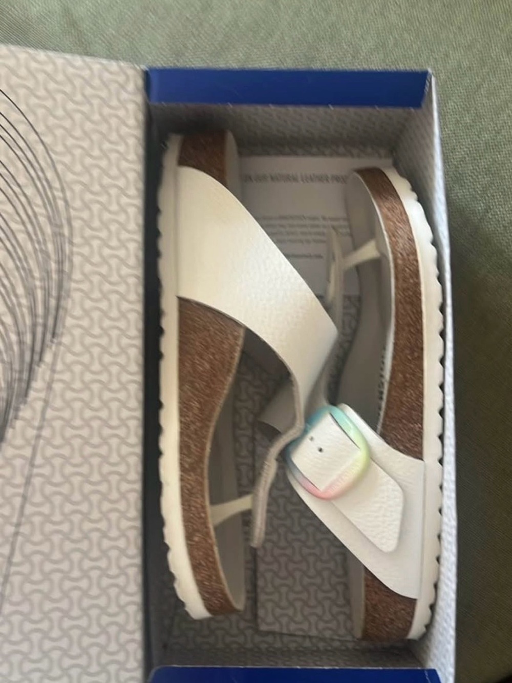 White Birkenstock Gizeh with rainbow big buckle
